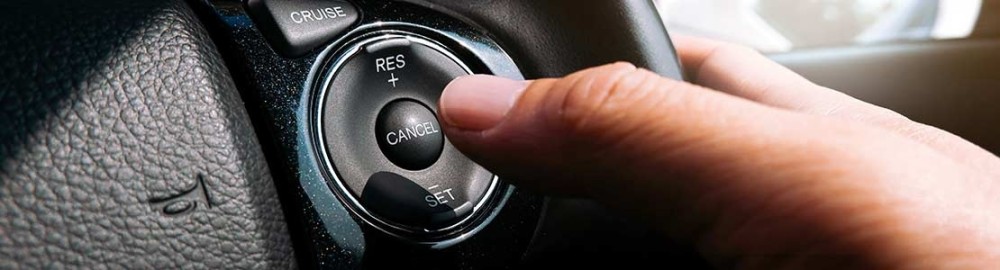cruise control speeds up downhill