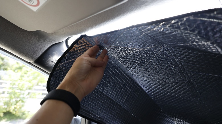 how much cooler does a windshield sunshade keep a parked car