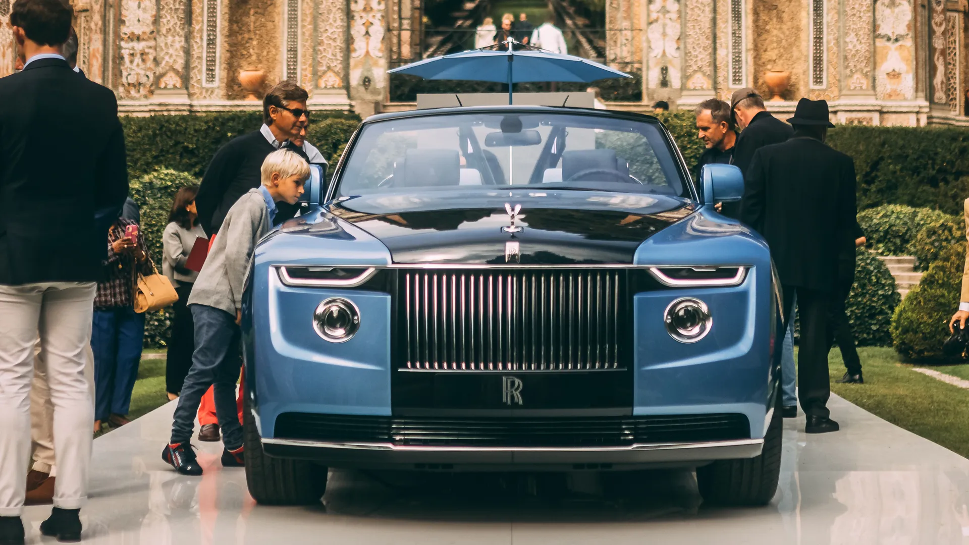 why rich people do not buy luxury cars