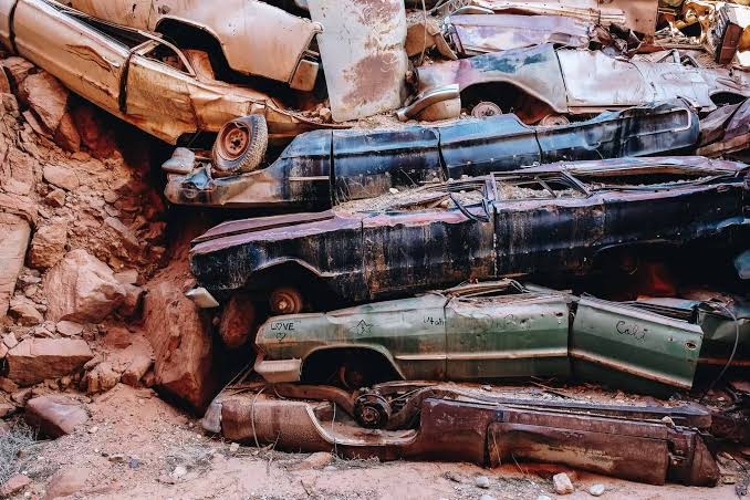 why there’s a wall of junk cars in a Utah canyon